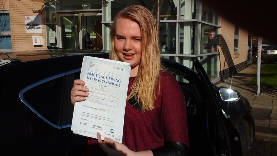 Driving test success - New driver celebrating with ADI qualified instructor